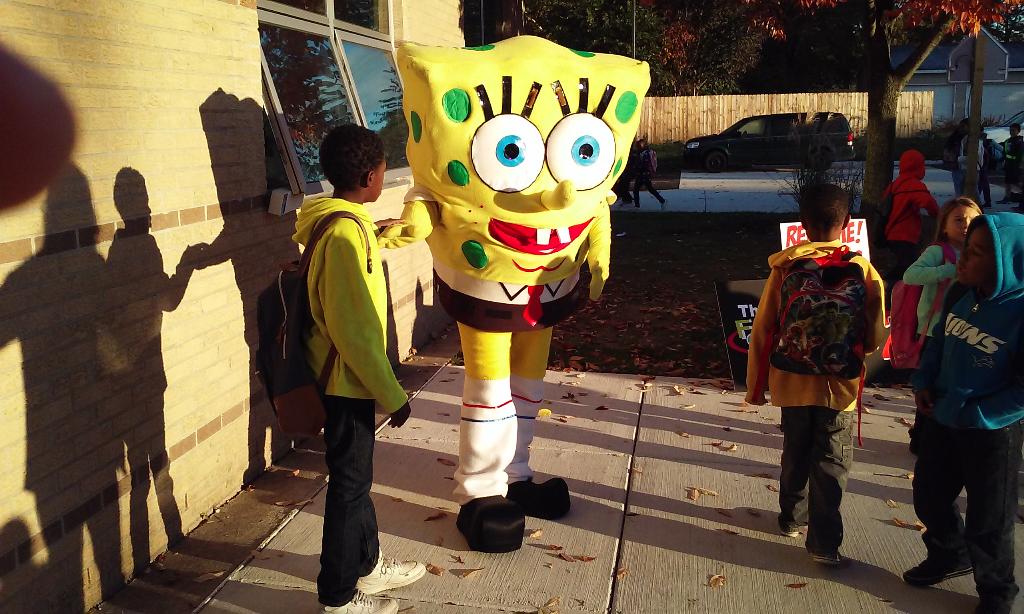 SpongeBob SquarePants makes an appearance! He stands with a few students.