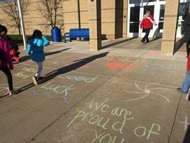 Chalk decorates the entrance of Brookwood, cheering on th 5th graders for M-Step!